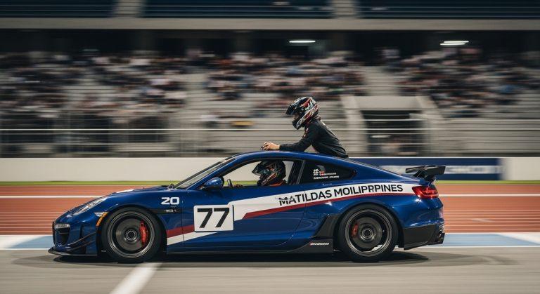 Diverse crowd at a Philippine motorsport event with sponsor banners and racing action.