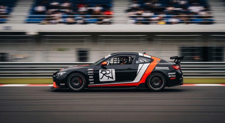 Toyota Gazoo Racing car on a Philippine racetrack with spectators and national flag-inspired livery